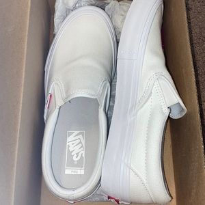 white slip on vans